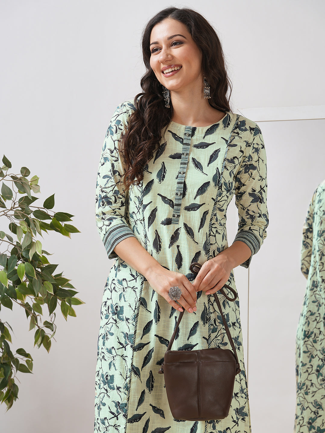 Straight fit shoulder princess kurta with piping between the seams and placket.