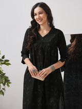 A gathered kurta with mirrorwork shoulder yoke and cuffed sleeves.
