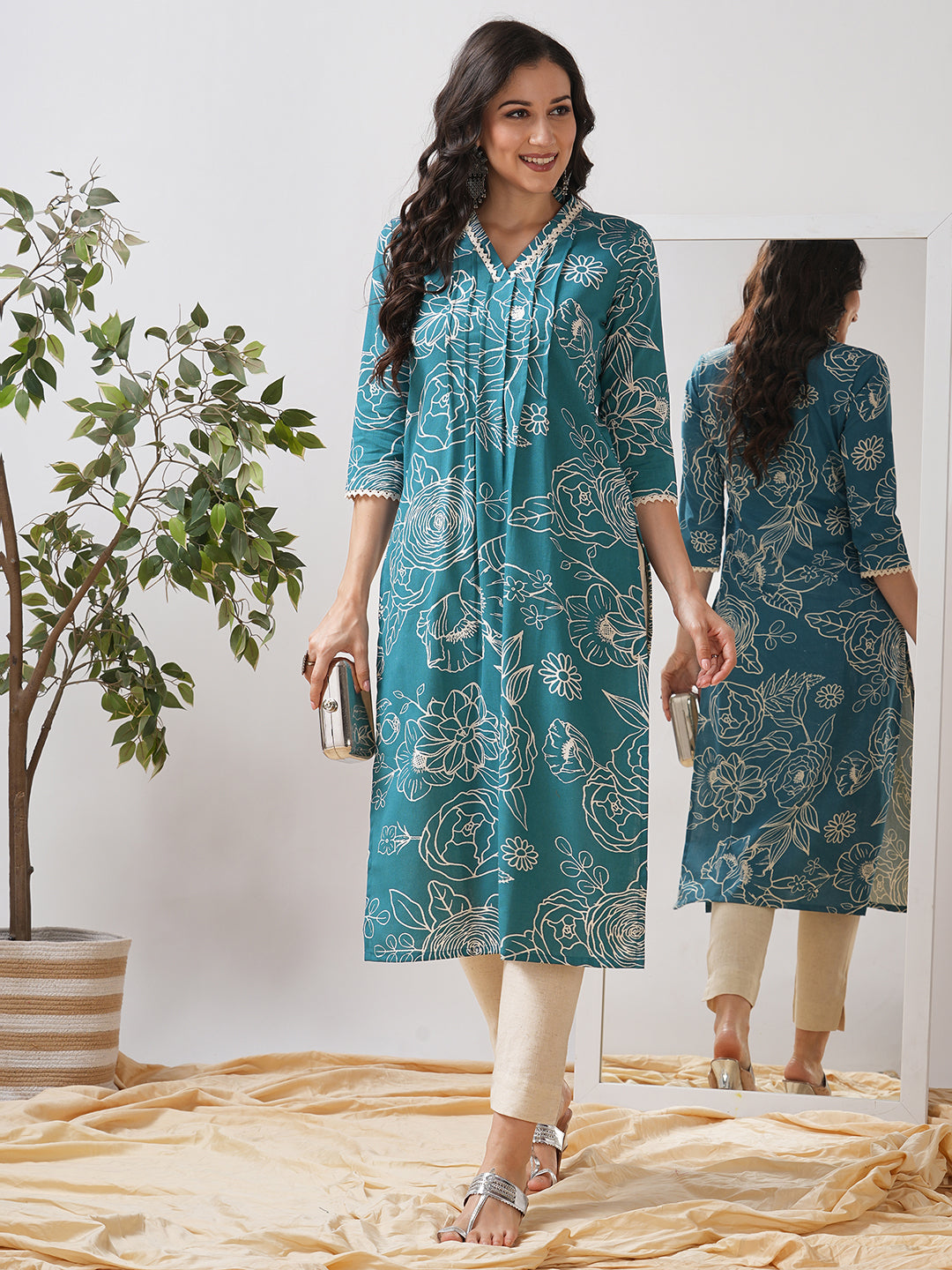 Straight fit kurta with lace detailing on neck and sleeves and tucks on the front.