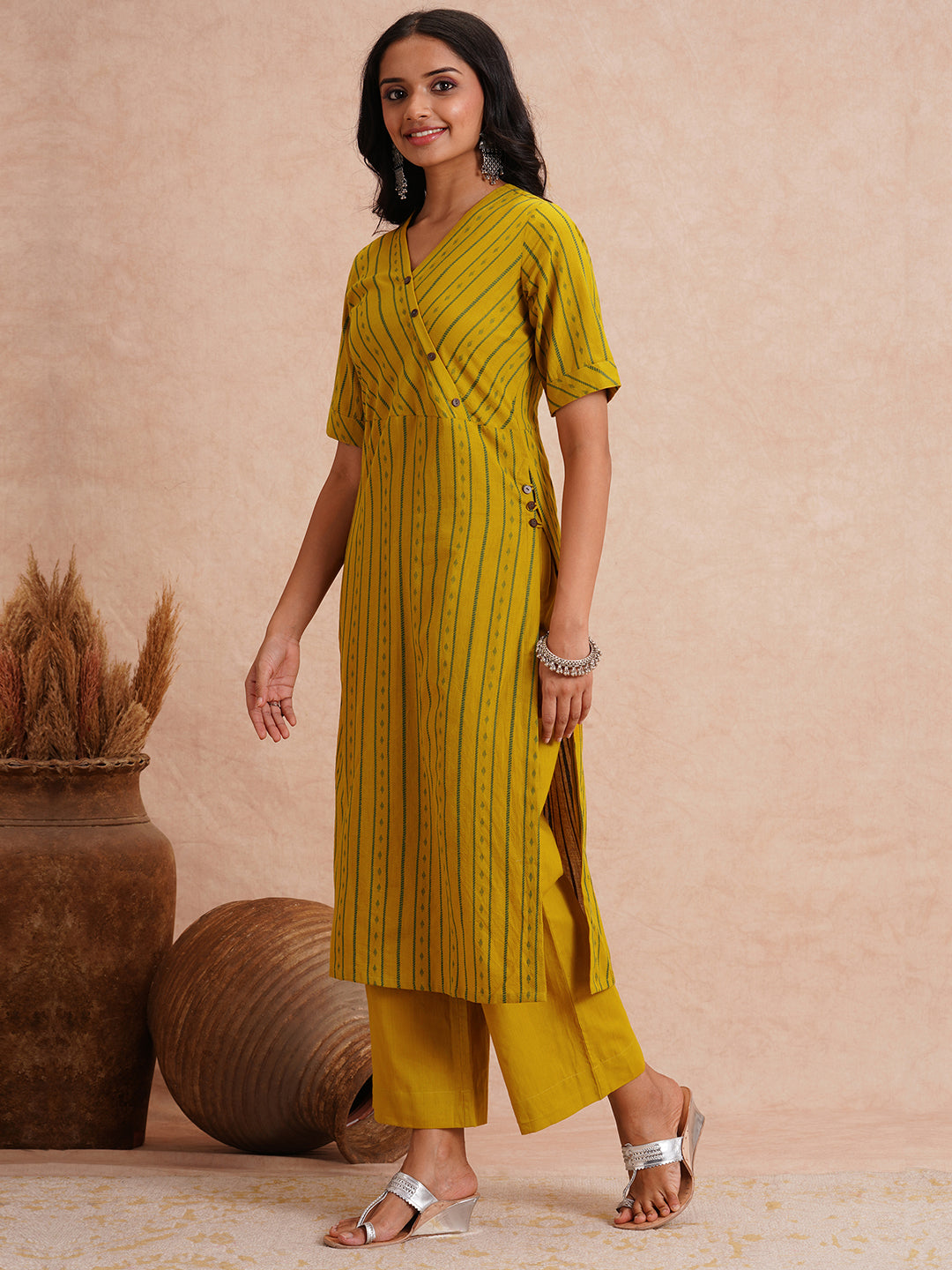 Straight fit kurta set with half sleeves and button detailing paired with plain palazzo.
