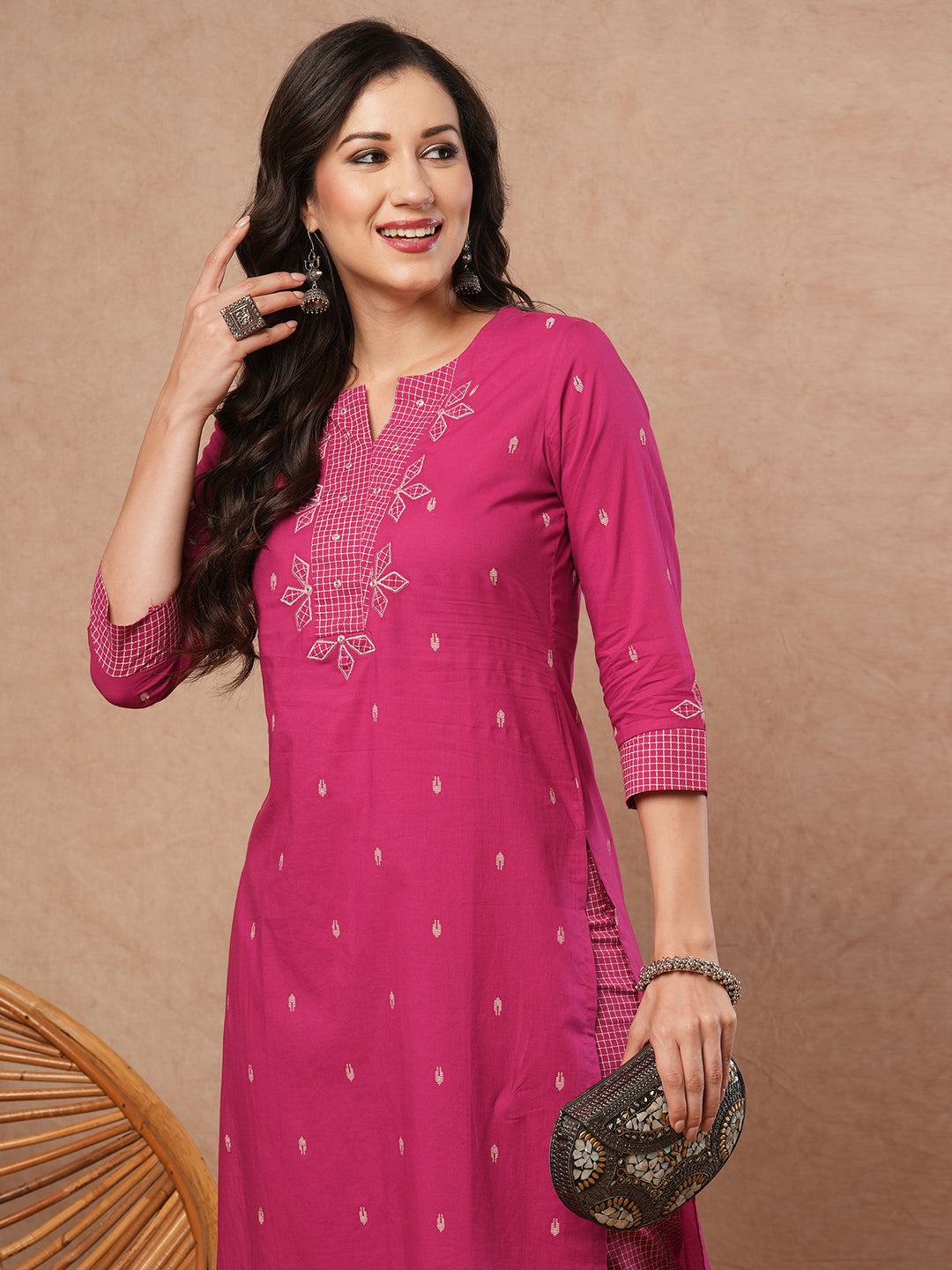 Straight fit kurta set with contrast trim fabric and applique on neck and sleeves.