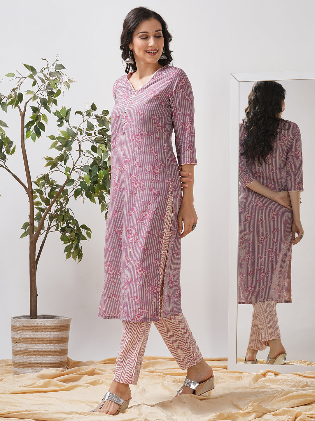 Straight kurta set with piping detailing on neck, sleeves and side slits paired with pant.