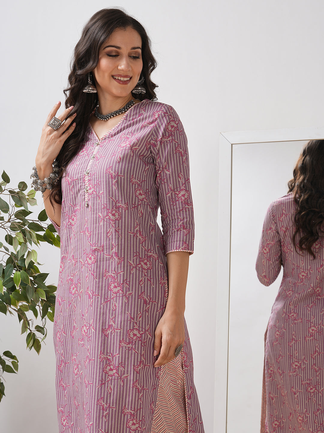 Straight kurta set with piping detailing on neck, sleeves and side slits paired with pant.