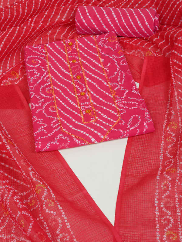 Red printed unstitched suit set includes a mix and match leheriya trim in the yoke.