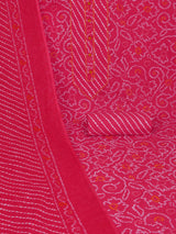 Red printed unstitched suit set includes a mix and match leheriya trim in the yoke.