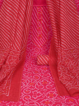 Red printed unstitched suit set includes a mix and match leheriya trim in the yoke.