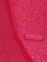 Red printed unstitched suit set includes a mix and match leheriya trim in the yoke.