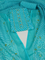 Aqua printed unstitched suit set includes a mix and match leheriya trim in the yoke.