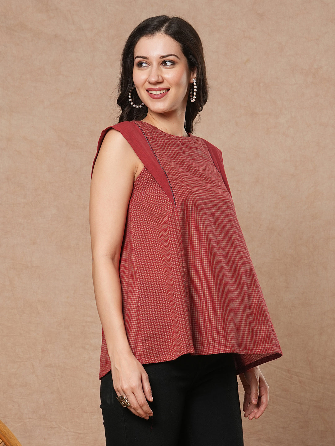 Flared top in chequered cotton fabric with hand embroidered running stitch