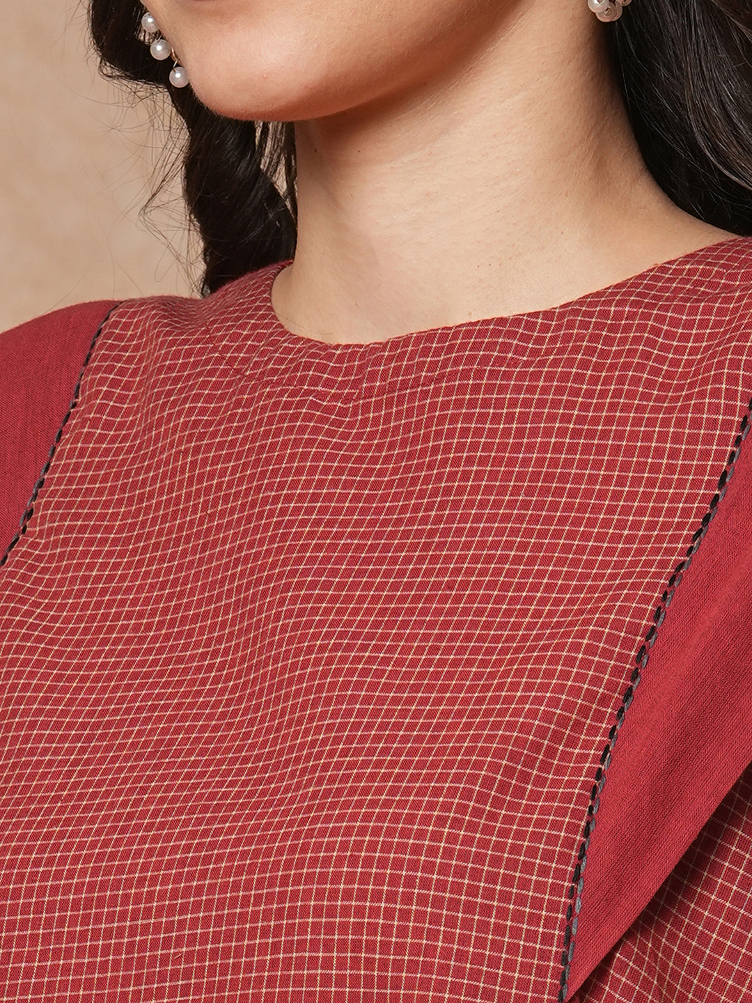 Flared top in chequered cotton fabric with hand embroidered running stitch