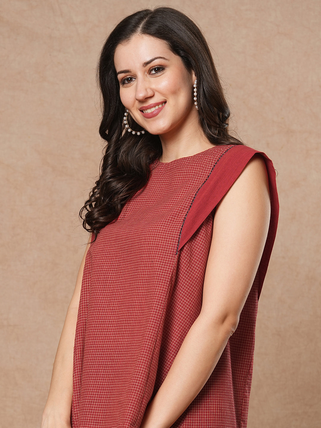 Flared top in chequered cotton fabric with hand embroidered running stitch