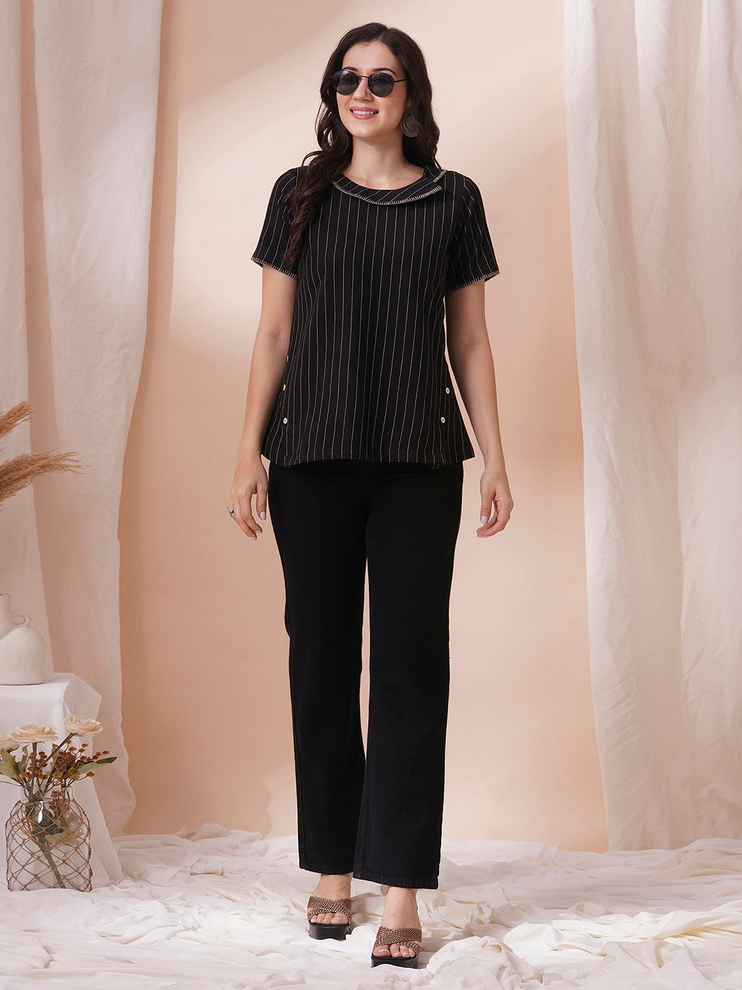 Striped cotton top with constructed collar and button detailing with hand embroidery.