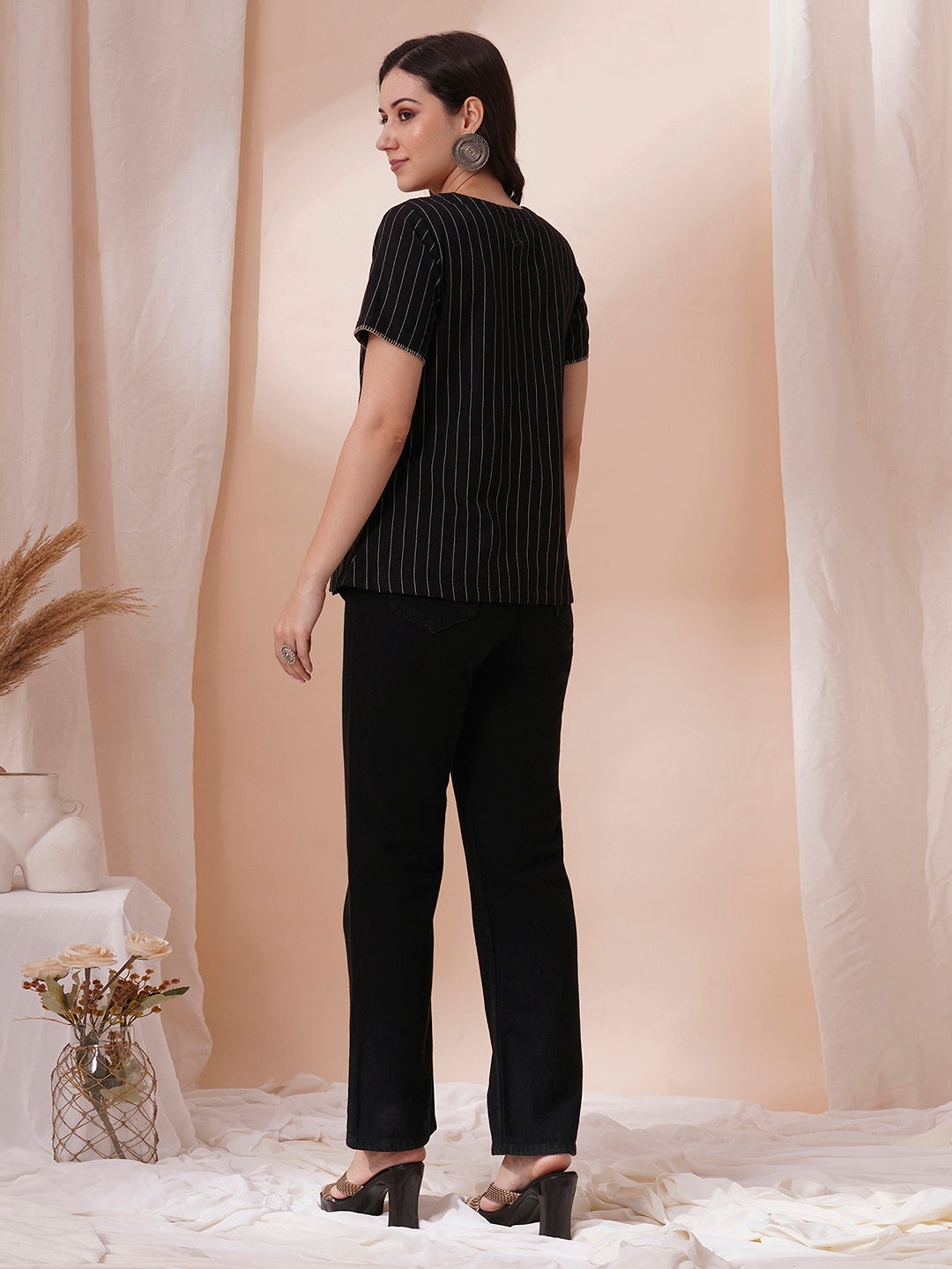 Striped cotton top with constructed collar and button detailing with hand embroidery.