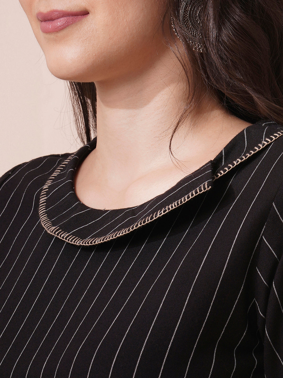 Striped cotton top with constructed collar and button detailing with hand embroidery.