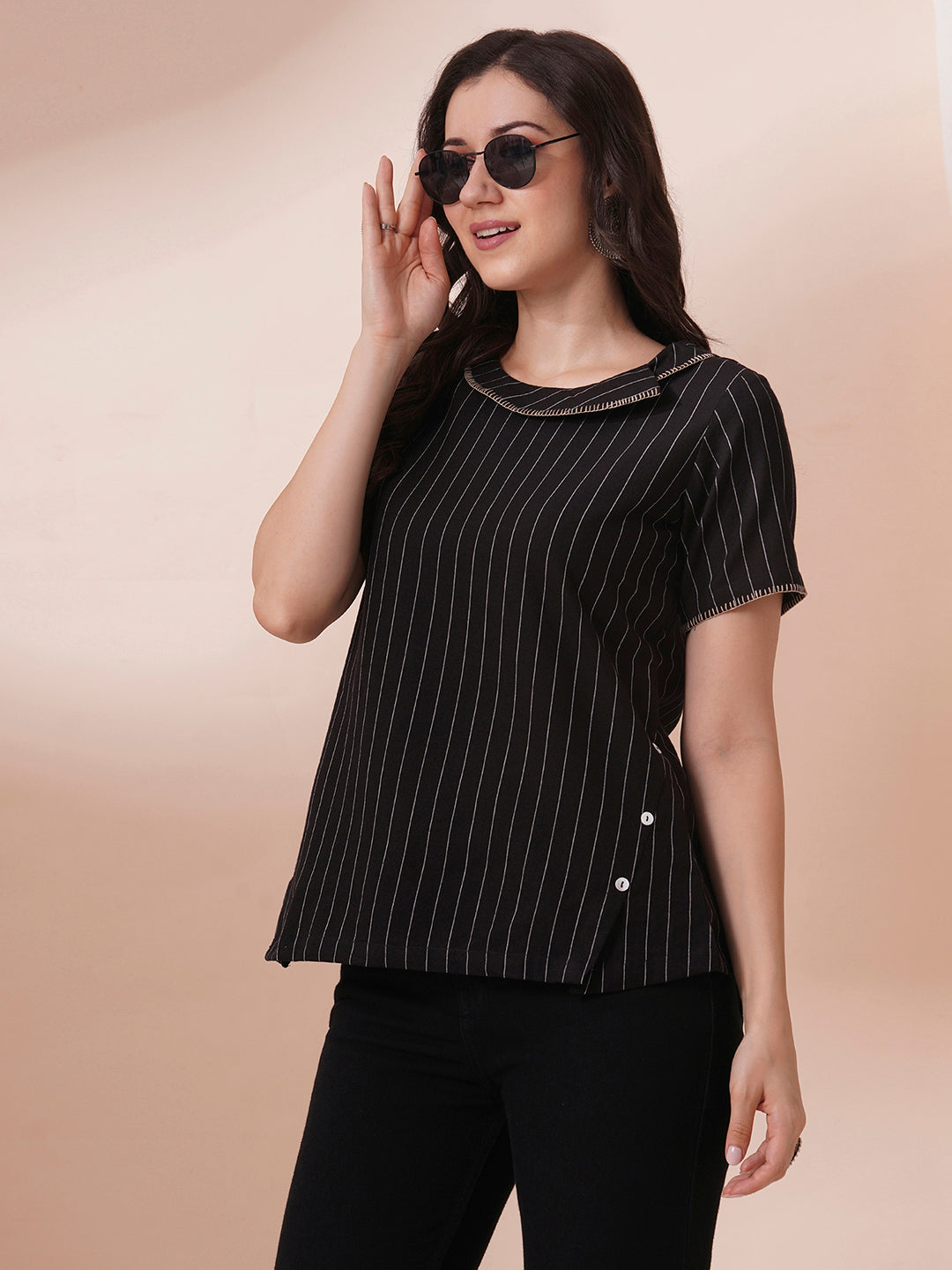 Striped cotton top with constructed collar and button detailing with hand embroidery.