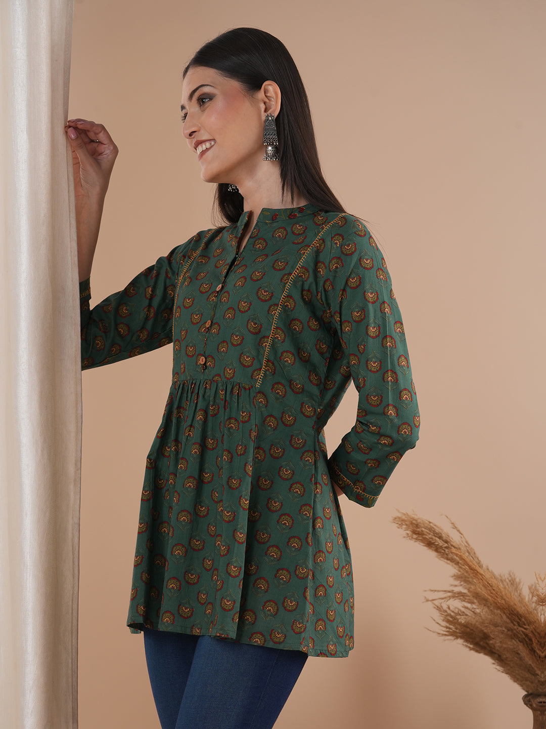 Gathered tunic in cotton print with hand embroidered feather stitch