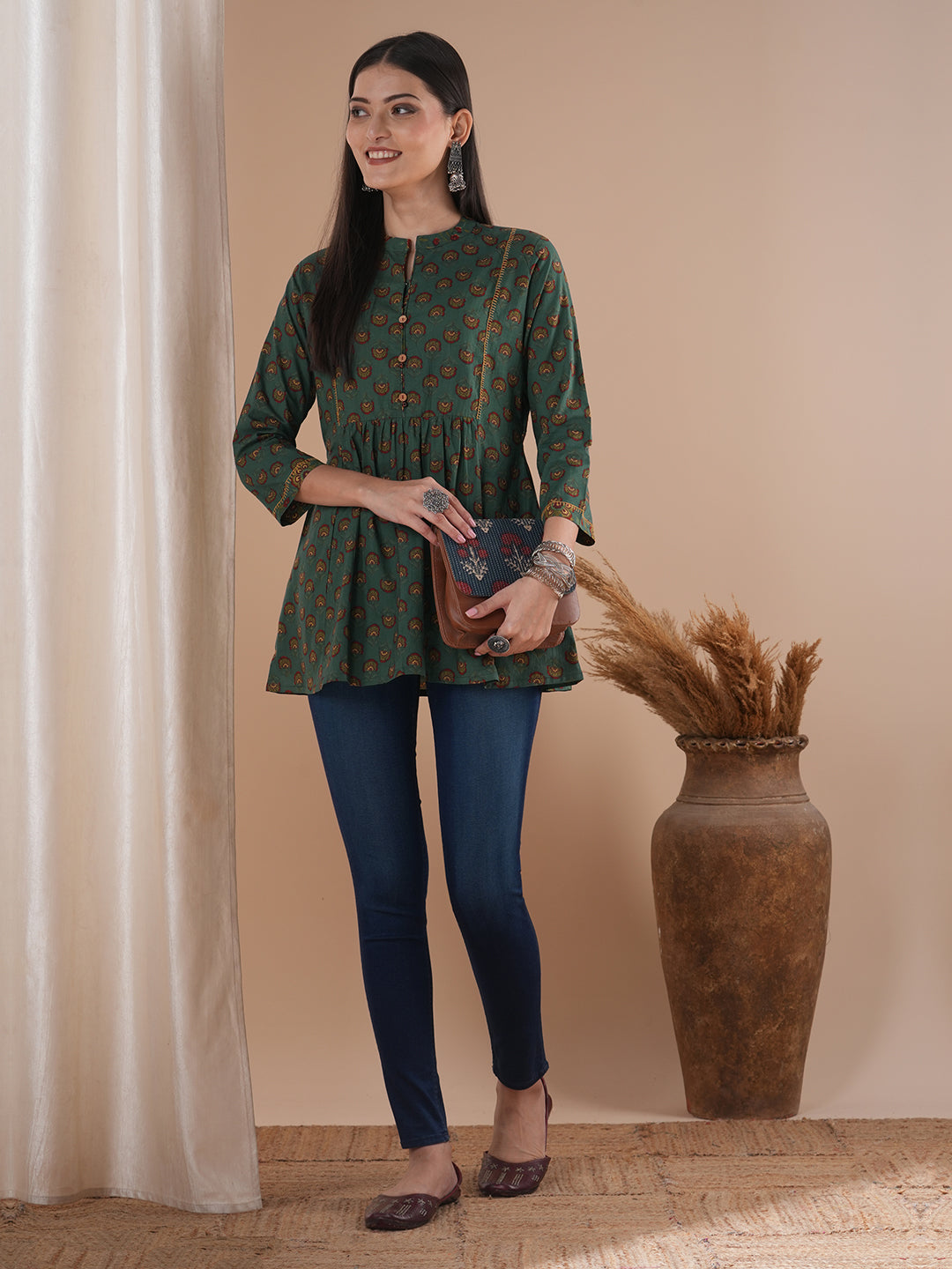 Gathered tunic in cotton print with hand embroidered feather stitch