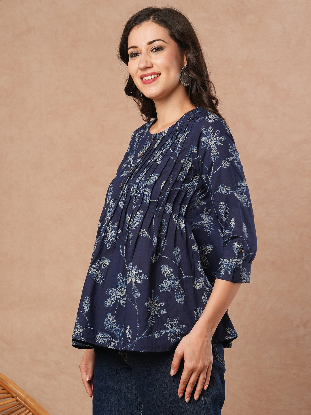 Pleated cotton print top with loop and button detailing on sleeve.
