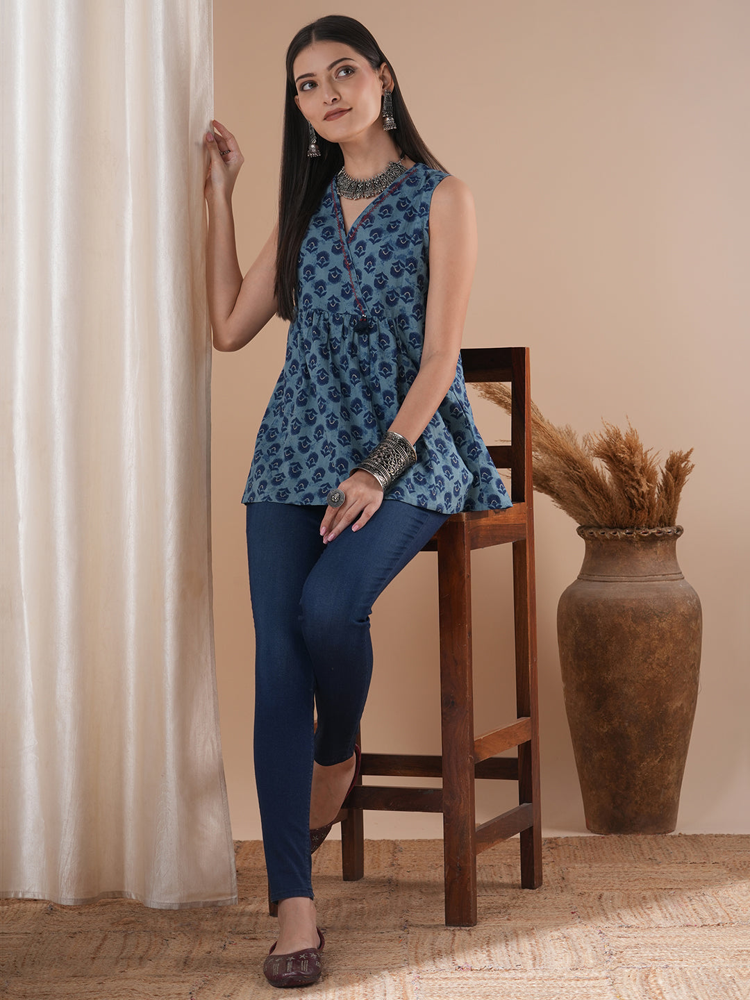 Sleeveless cotton print top with hand embroidered feather stitch and tassels