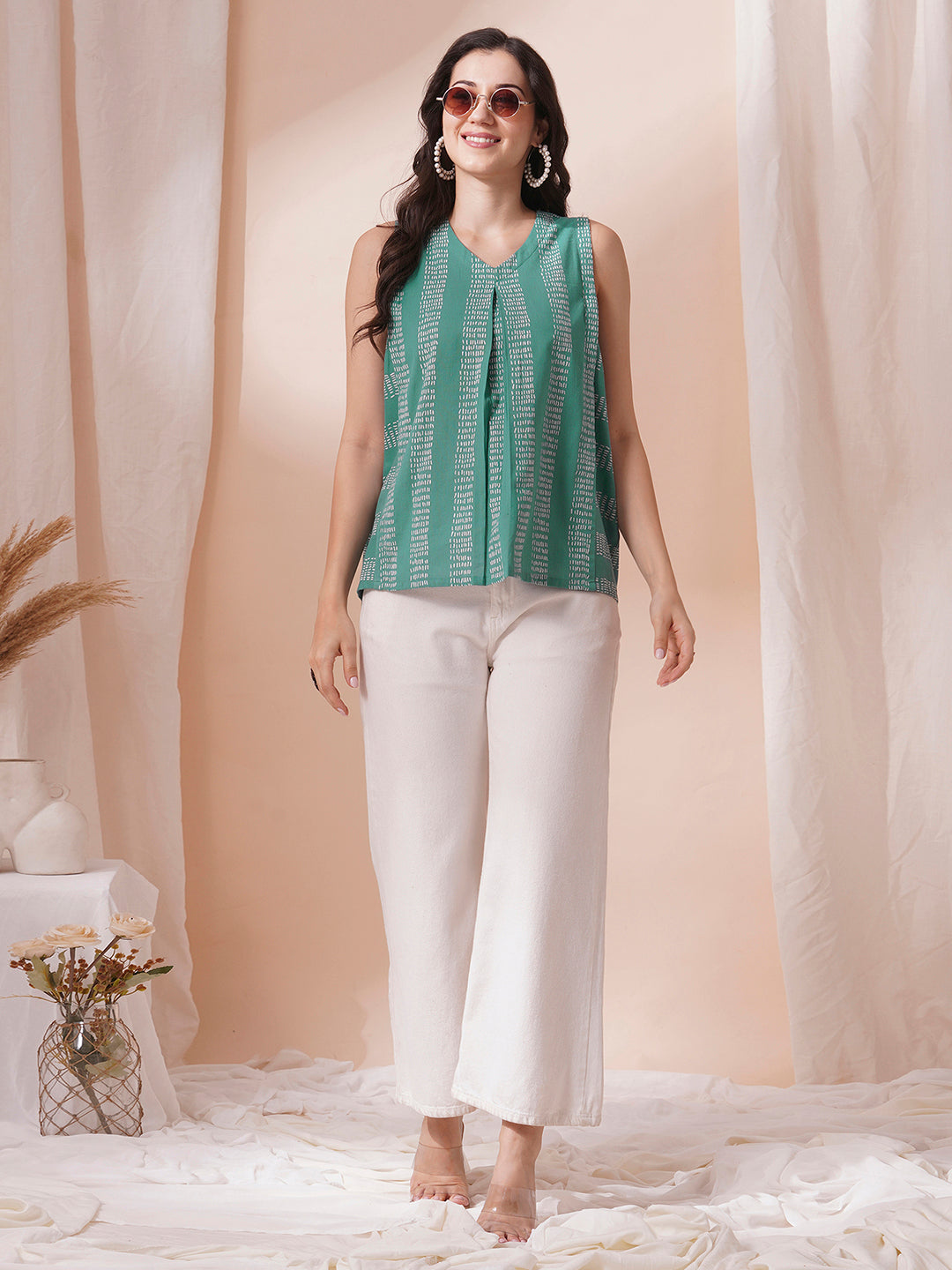 Printed flex sleeveless top with center pleat and elasticated gathers.