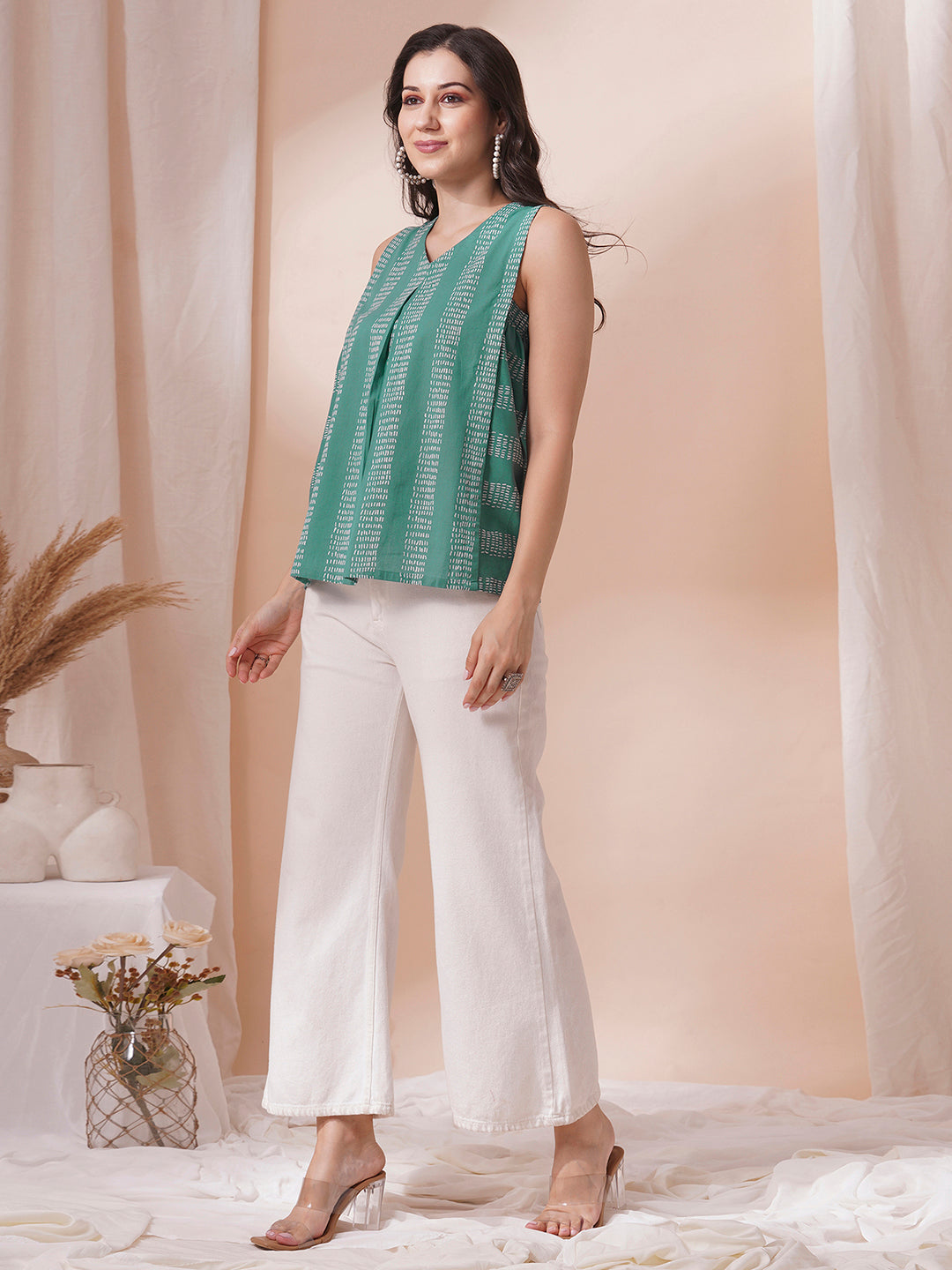 Printed flex sleeveless top with center pleat and elasticated gathers.