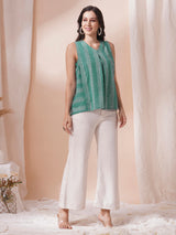 Printed flex sleeveless top with center pleat and elasticated gathers.