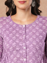 Printed top with centre button placket and pleated side panels.