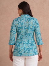Printed top with knife pleat detailing and a V-neckline.