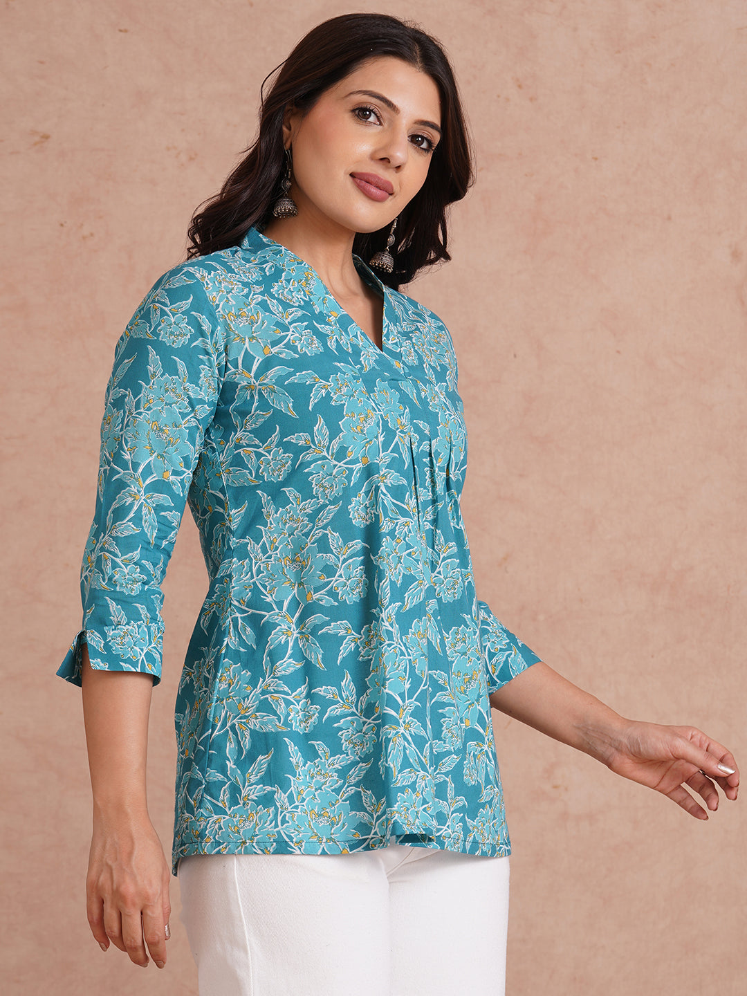 Printed top with knife pleat detailing and a V-neckline.