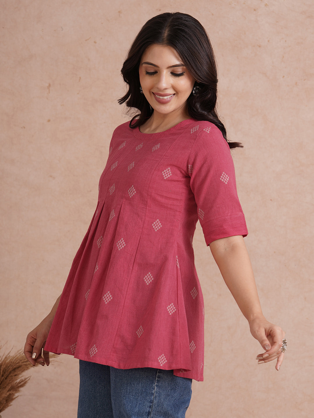 Pleated top with dobby fabric panels and elbow sleeves.