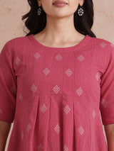 Pleated top with dobby fabric panels and elbow sleeves.