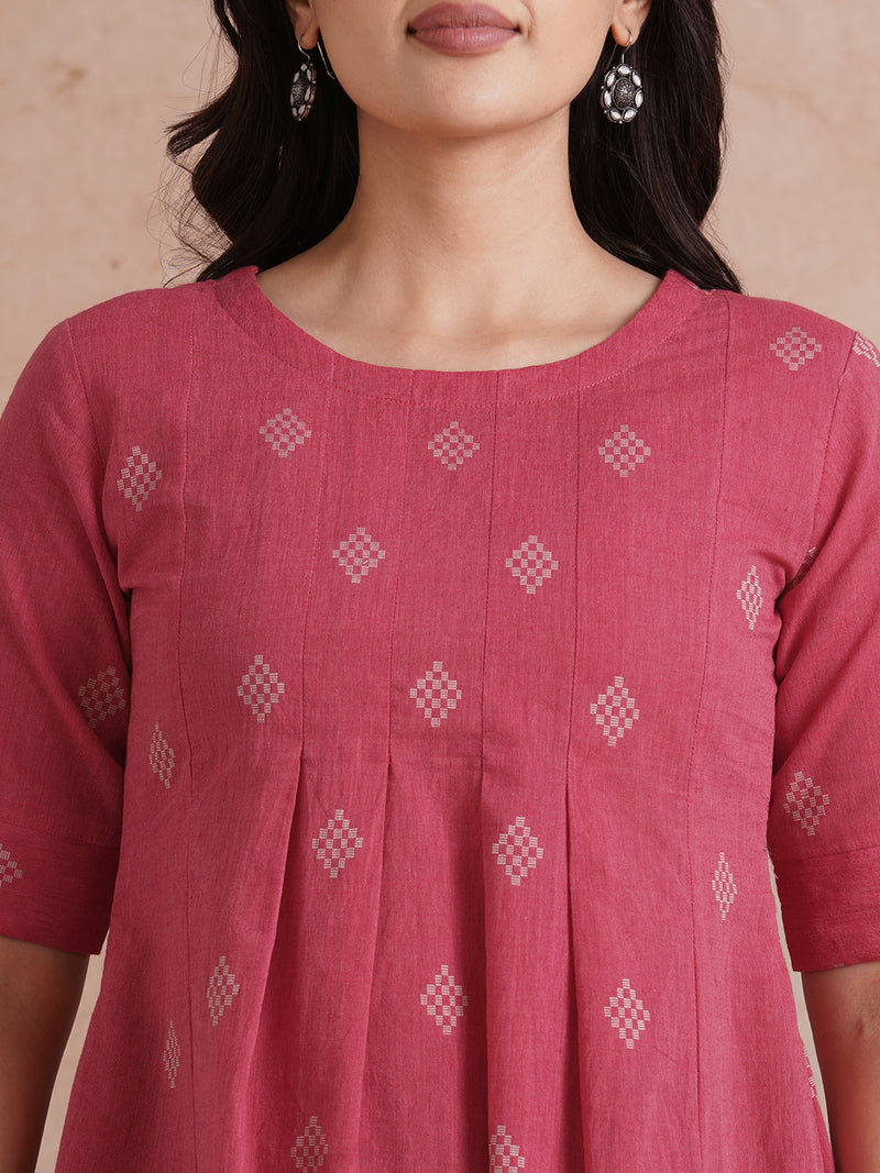 Pleated top with dobby fabric panels and elbow sleeves.