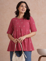 Pleated top with dobby fabric panels and elbow sleeves.