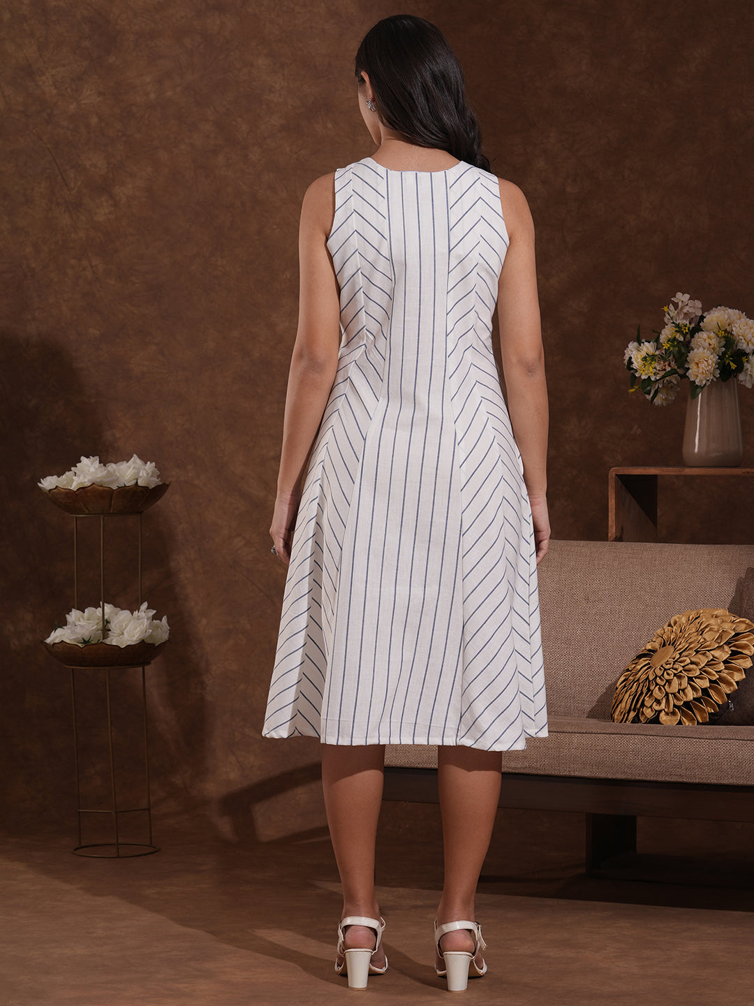 Pocketed striped sleeveless hand block printed dress with hand embroidery.