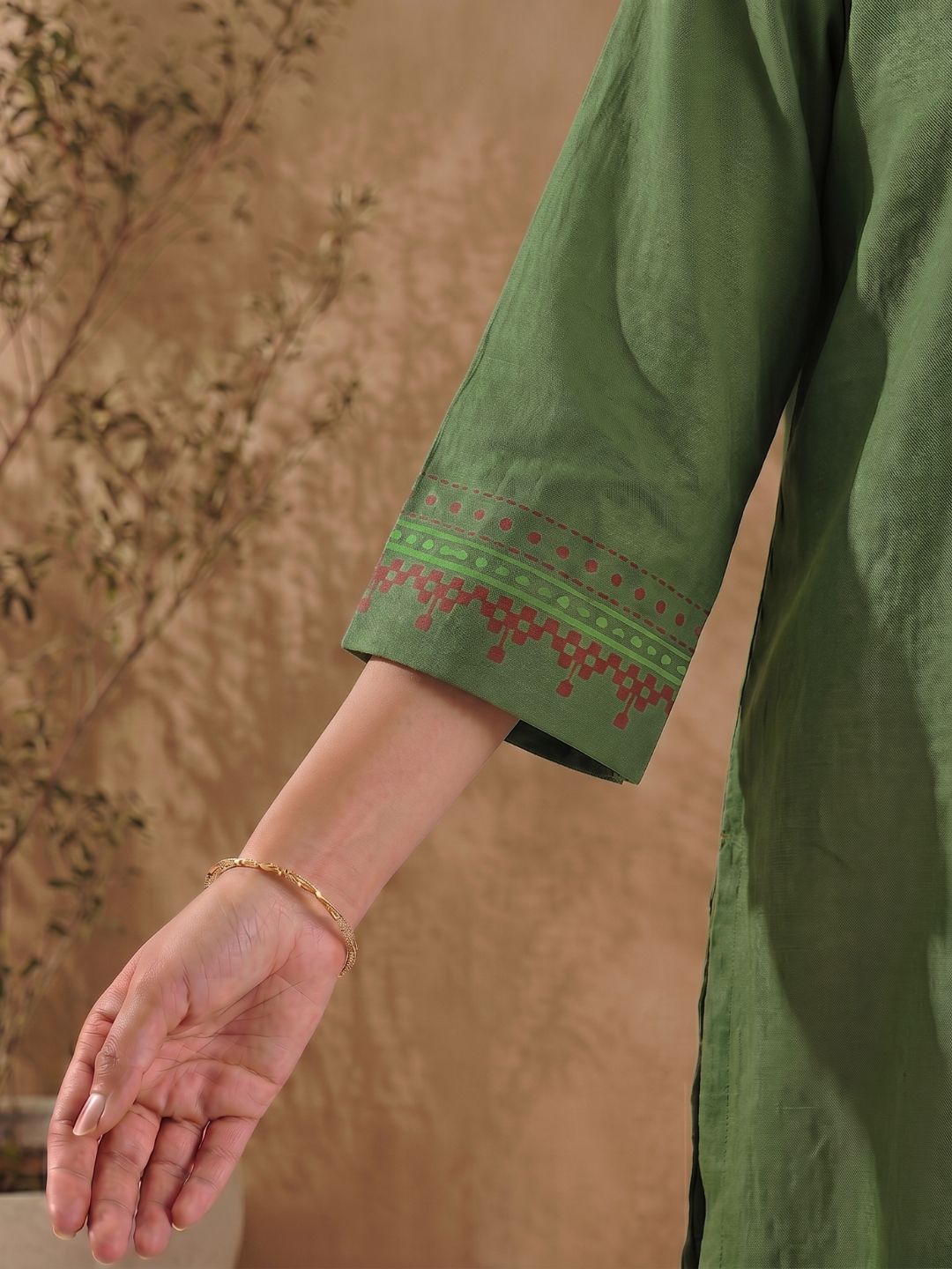 Straight Fit Cotton Kurta with Intricate Embroidered Yoke & Printed Sleeve Detail.