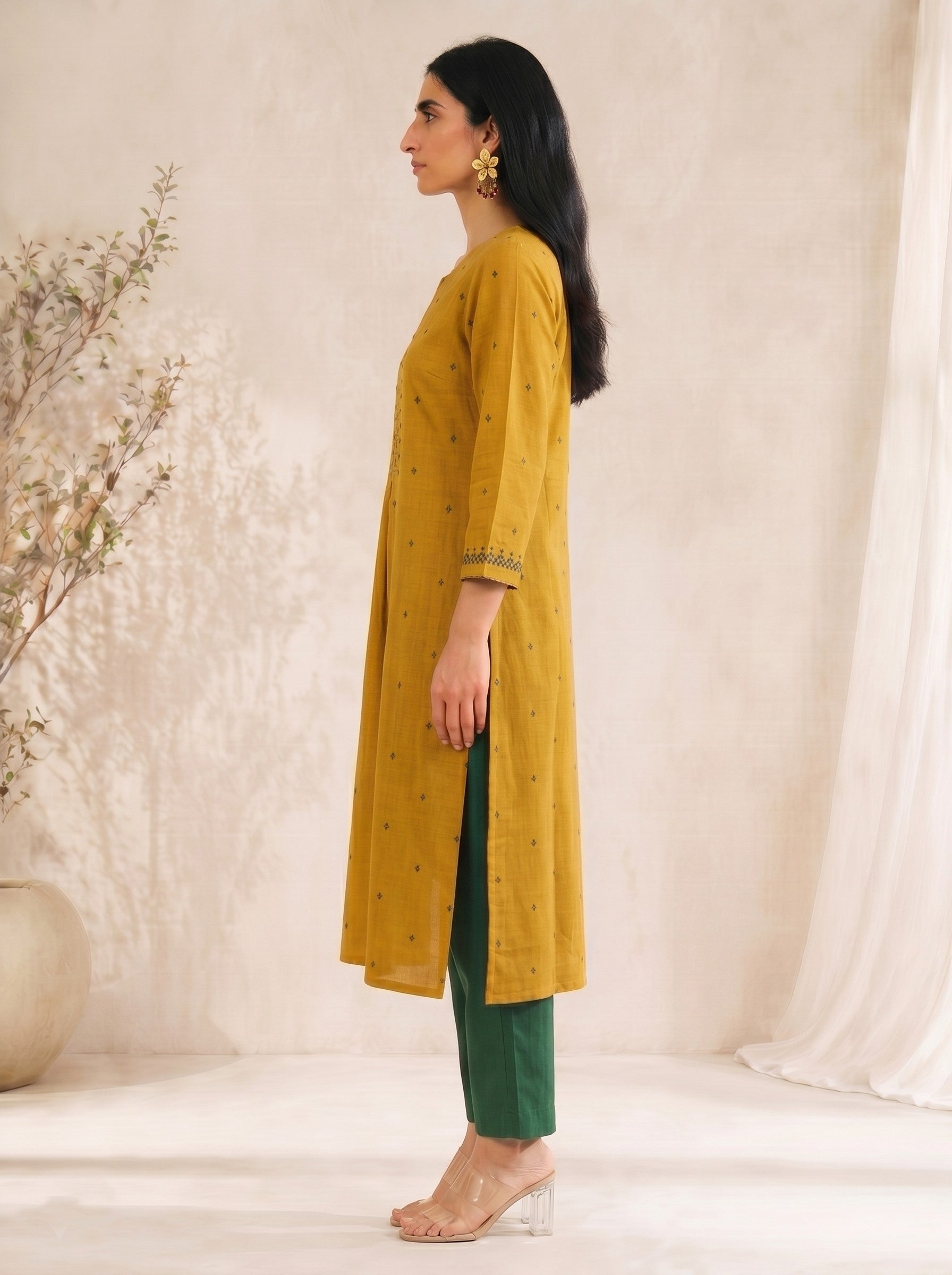 Straight fit cotton dobby kurta with tucks and block print on front and sleeves.