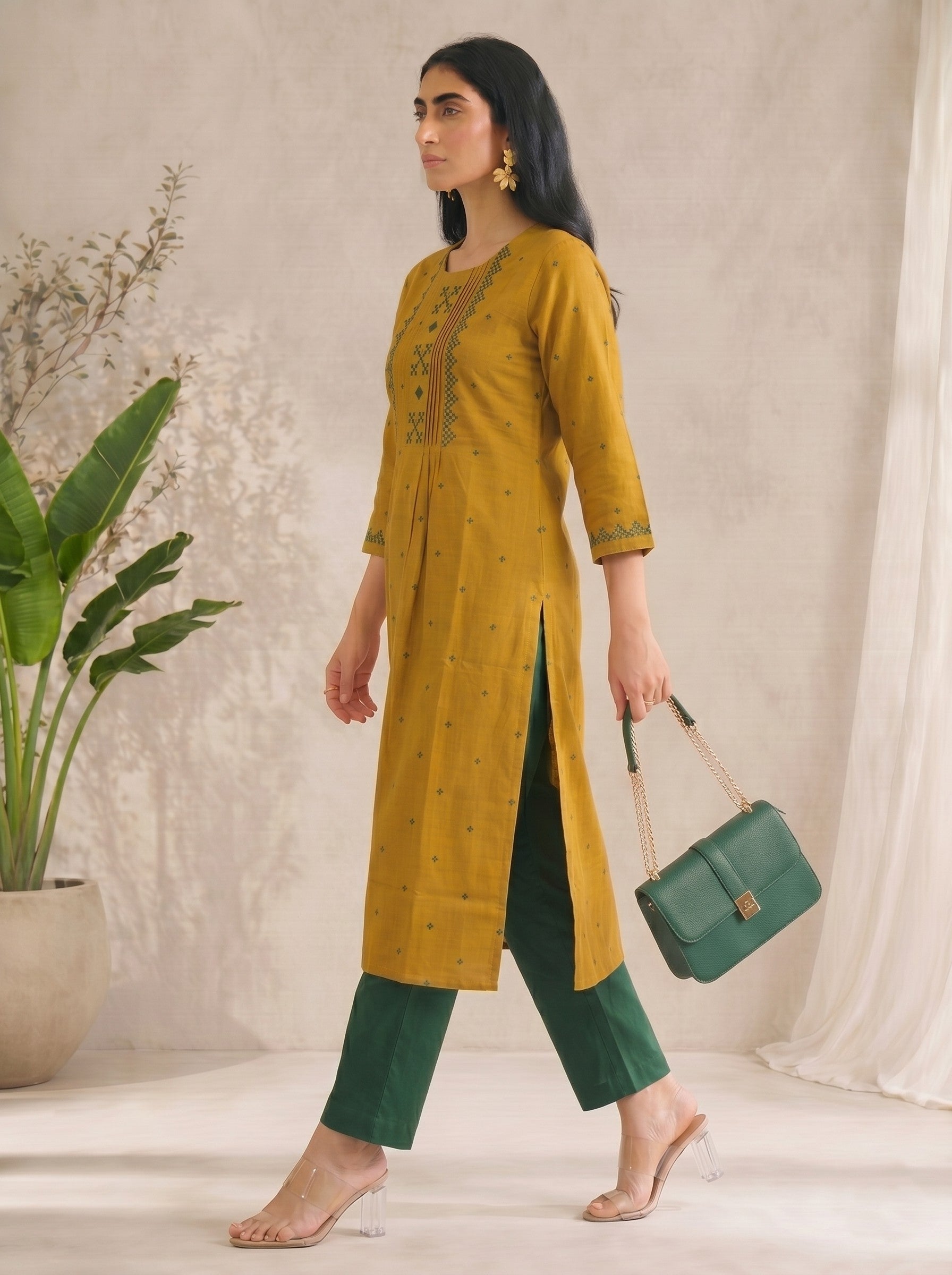 Straight fit cotton dobby kurta with tucks and block print on front and sleeves.