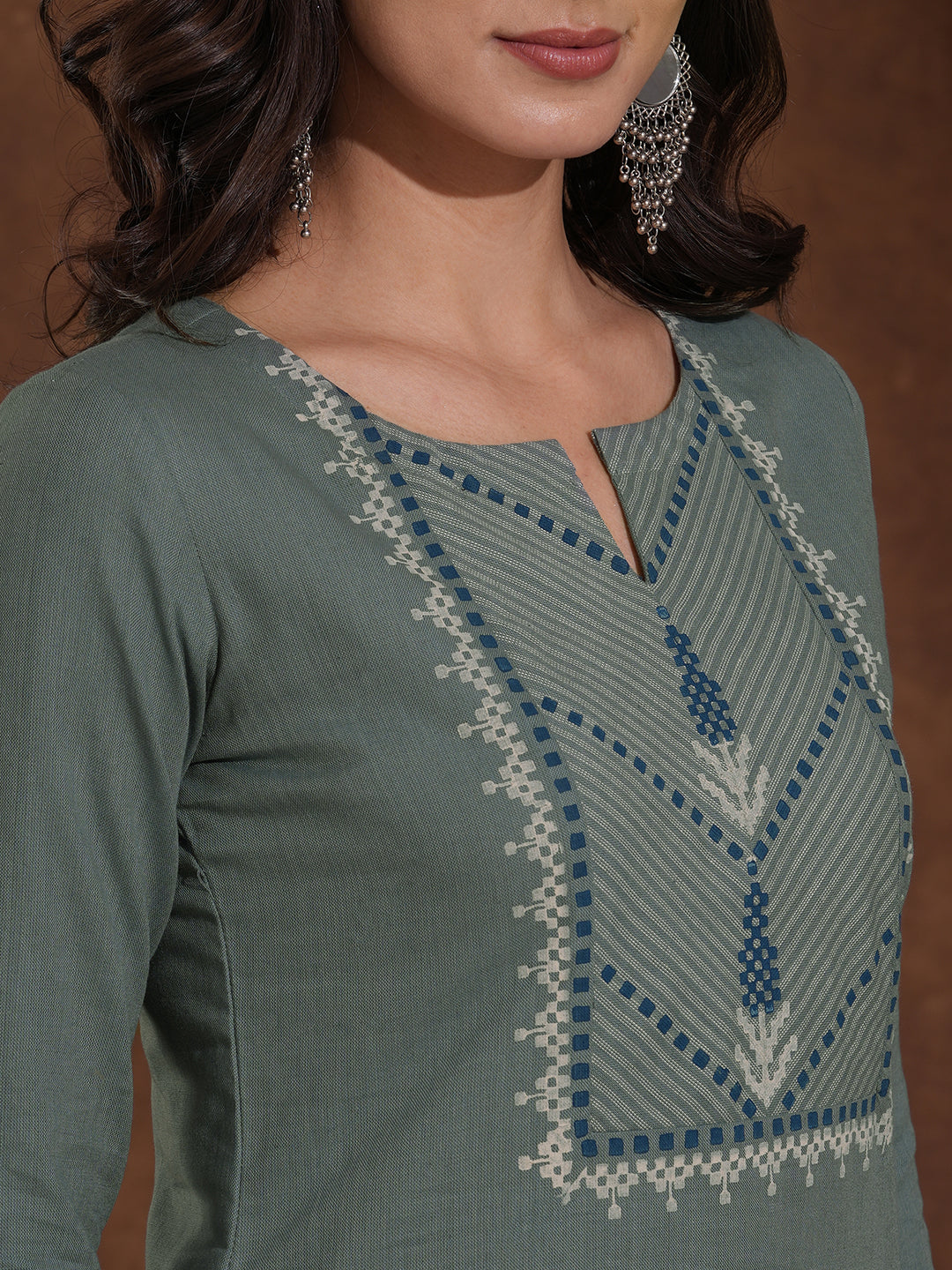 Straight fit kurta with block printed striped yoke and block printed striped cuff.