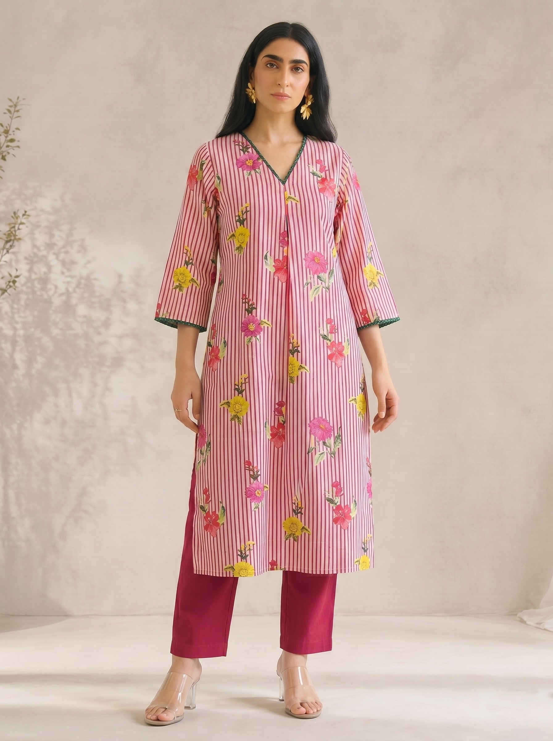 JOYLAND-Printed A-line Cambric kurta with center box pleat, bell sleeves and piping on neck and sleeves with beads.