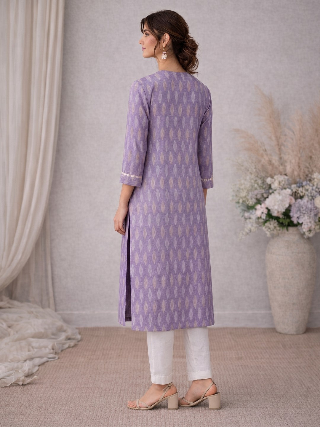 Cotton Ikat fabric straight kurta with woven stripe piping and handwork.