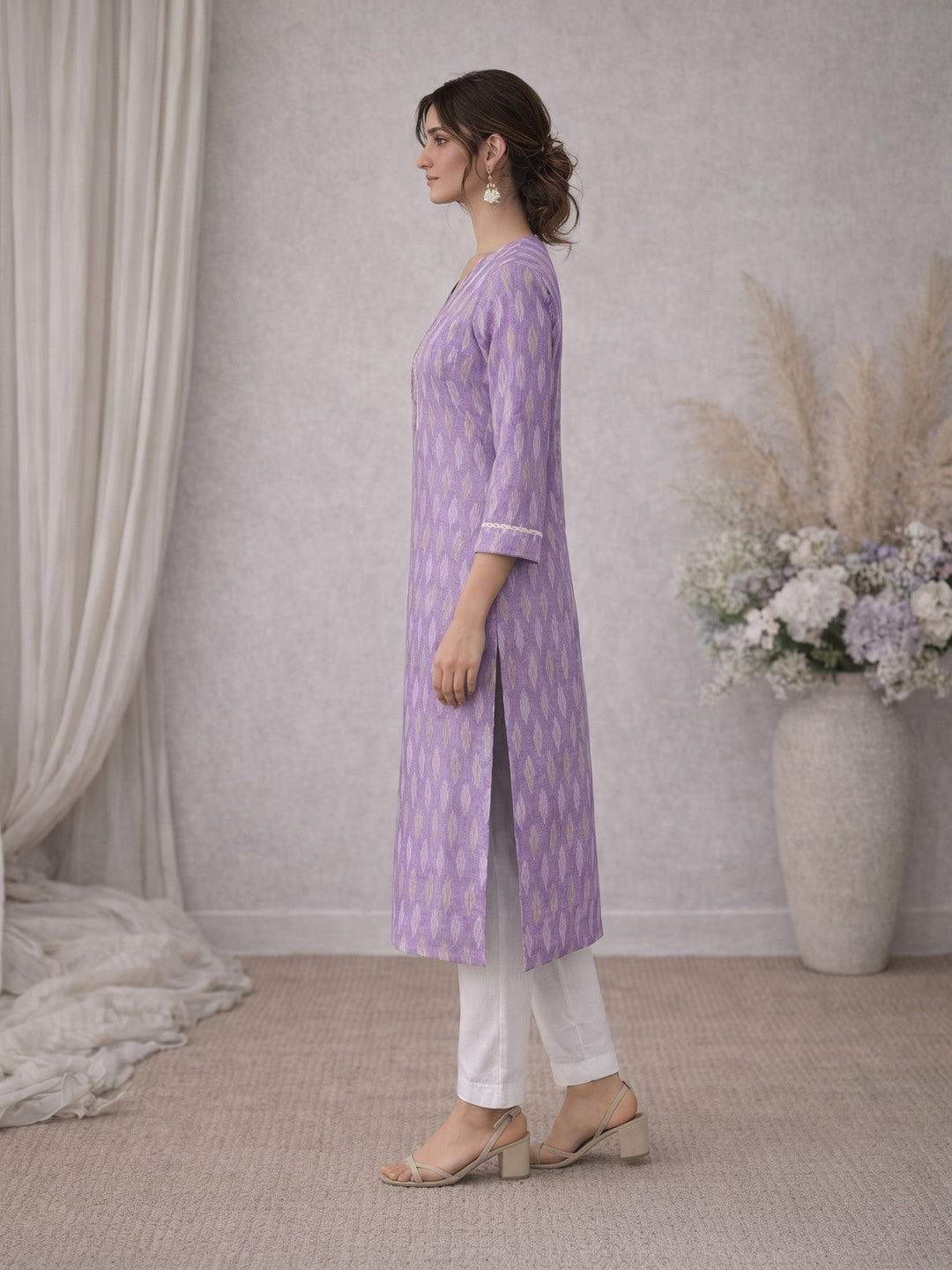 Cotton Ikat fabric straight kurta with woven stripe piping and handwork.