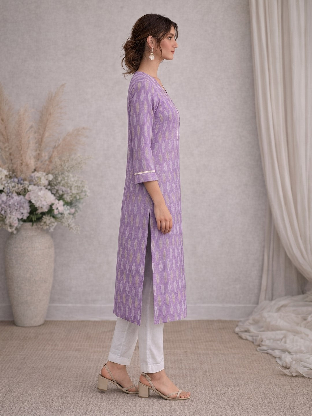 Cotton Ikat fabric straight kurta with woven stripe piping and handwork.