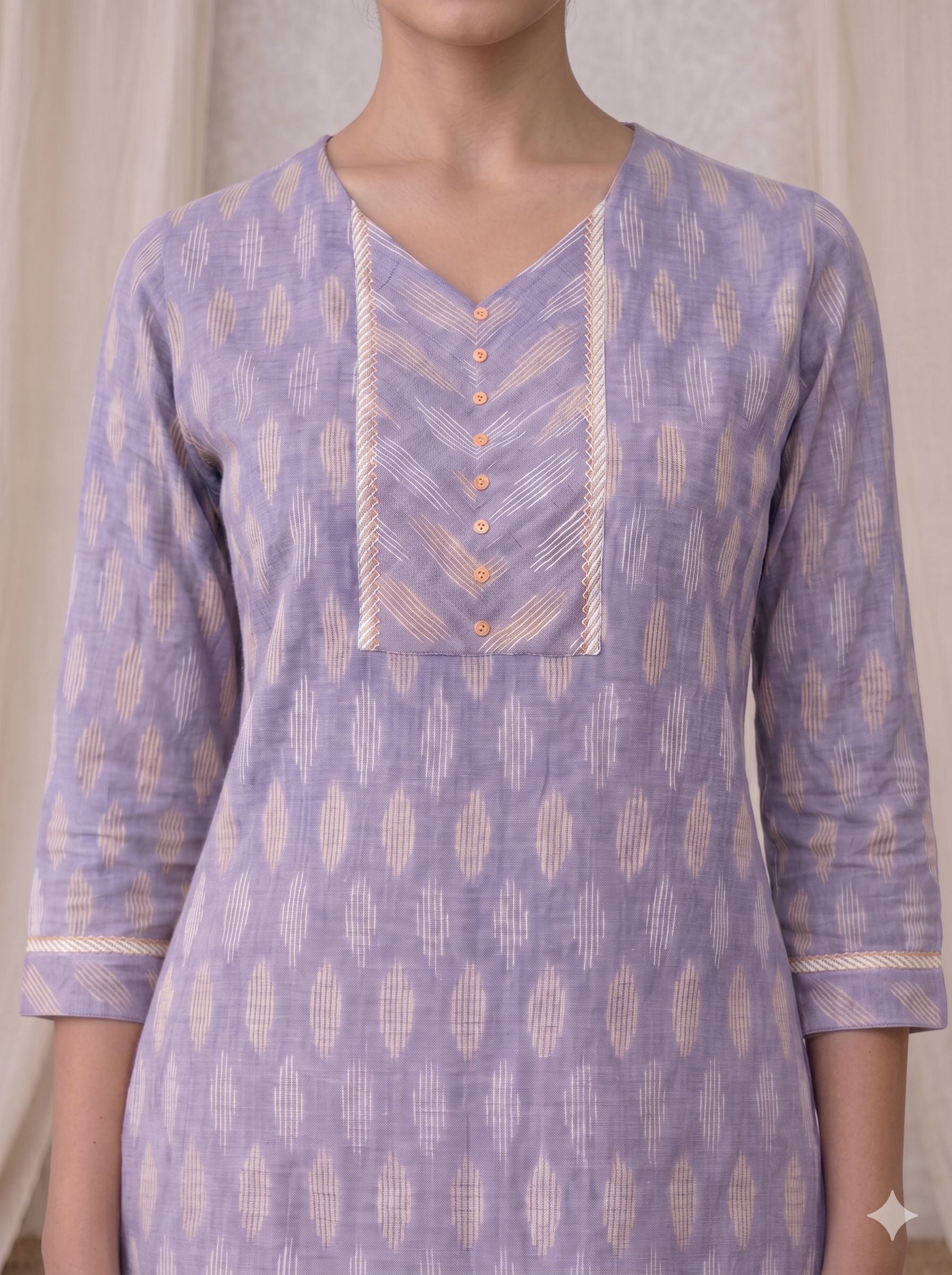 Cotton Ikat fabric straight kurta with woven stripe piping and handwork.