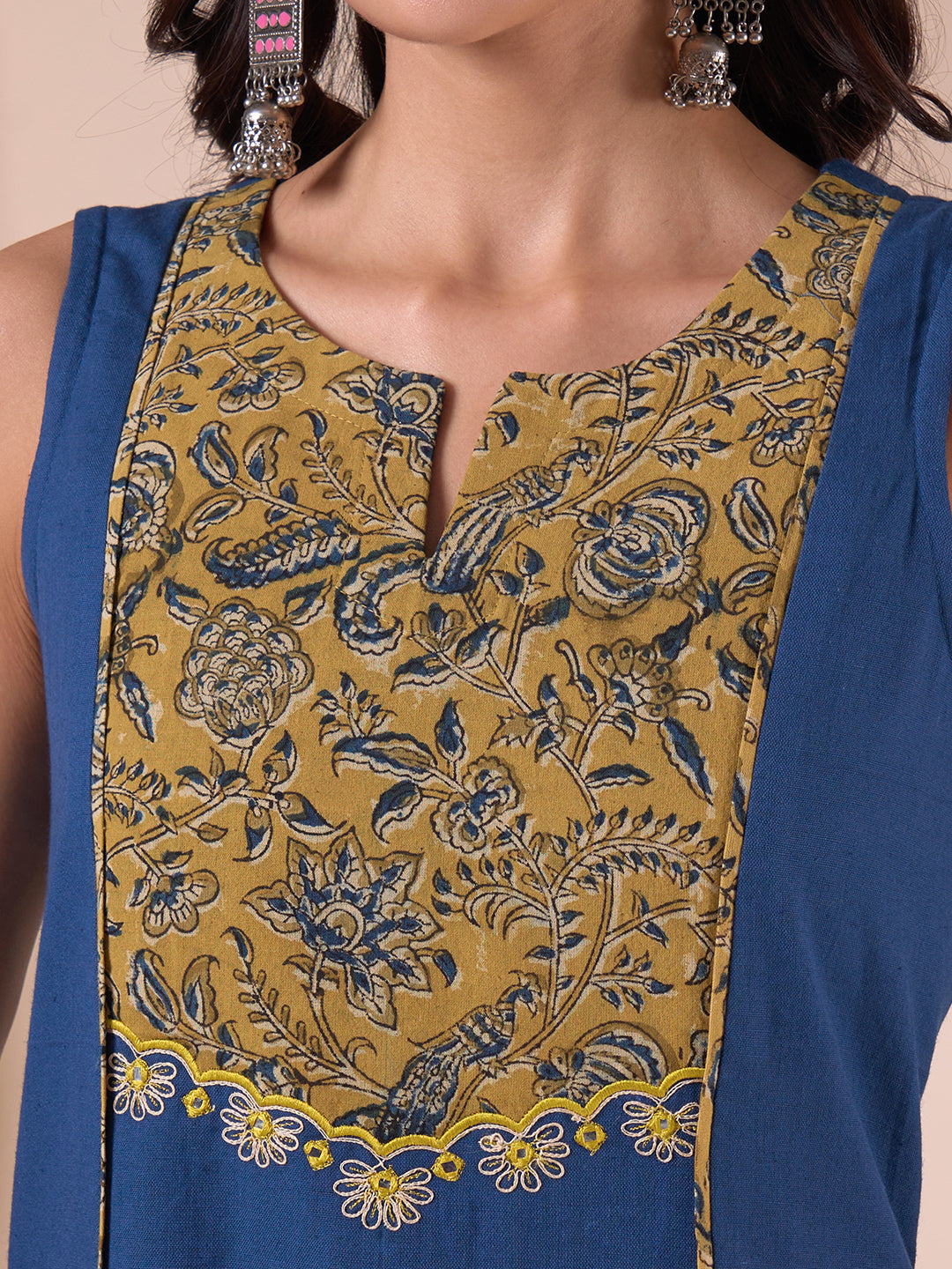 A-Line Sleeveless Kalamkari Cutwork Yoke Cotton Kurta with Contrast Piping.