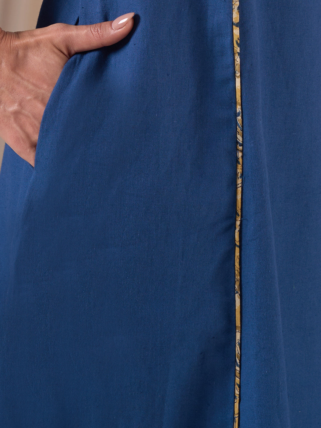 A-Line Sleeveless Kalamkari Cutwork Yoke Cotton Kurta with Contrast Piping.