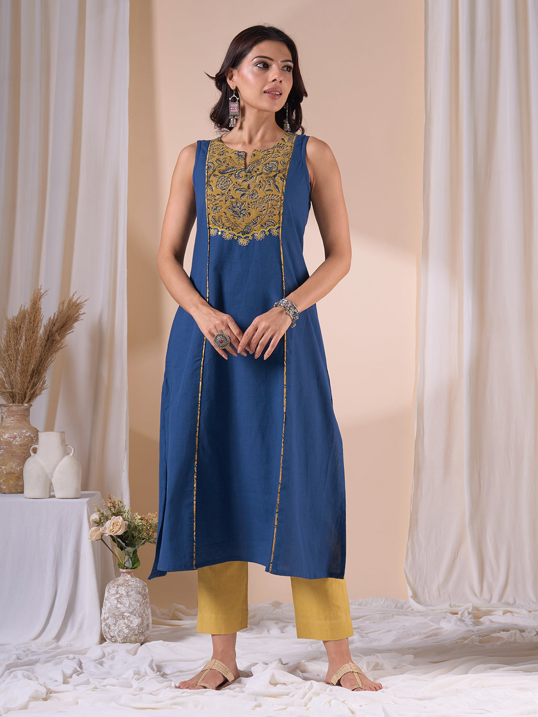 A-Line Sleeveless Kalamkari Cutwork Yoke Cotton Kurta with Contrast Piping.