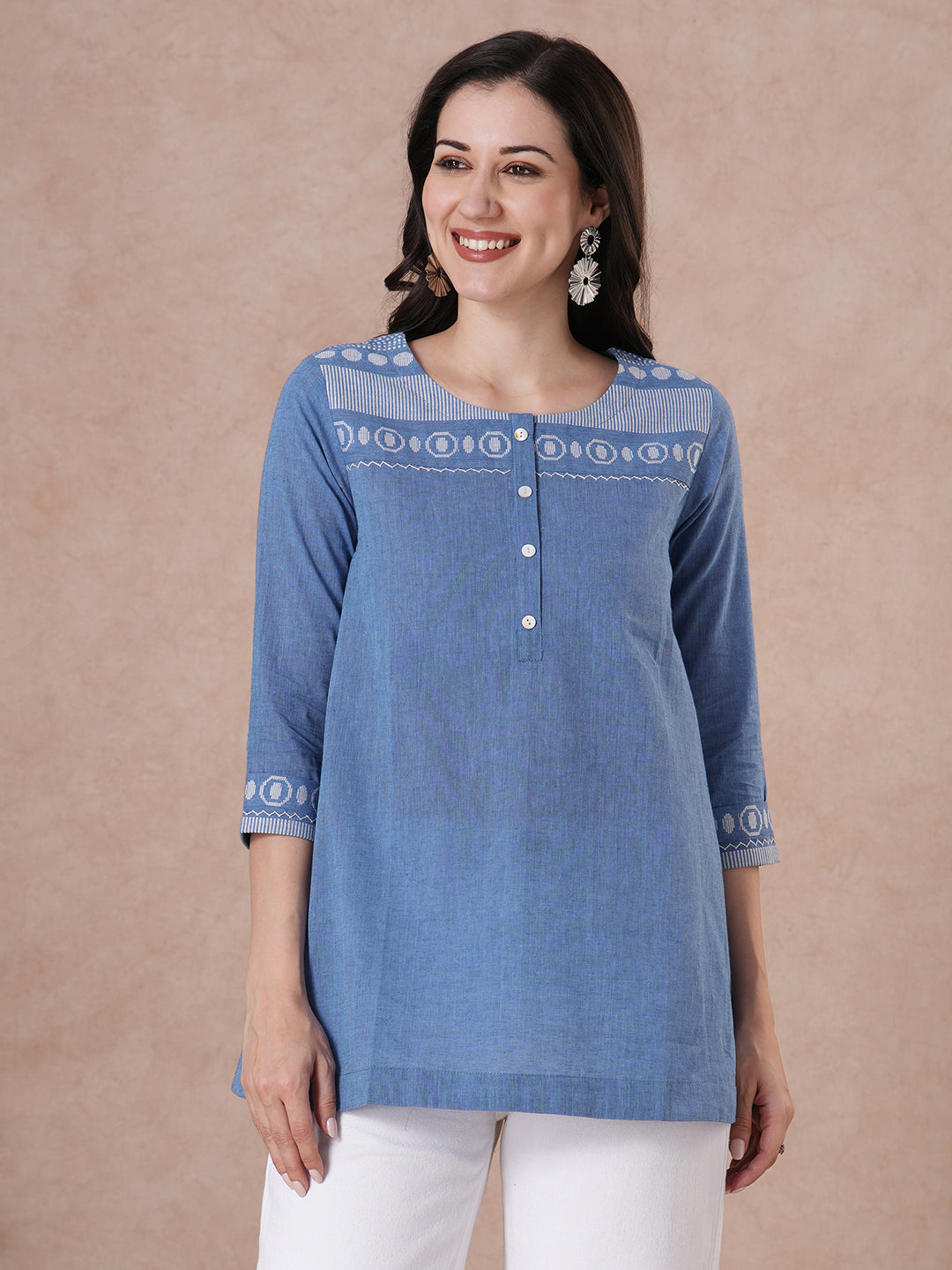 Woven cotton dobby tunic in light pink shade with hand embroidery.