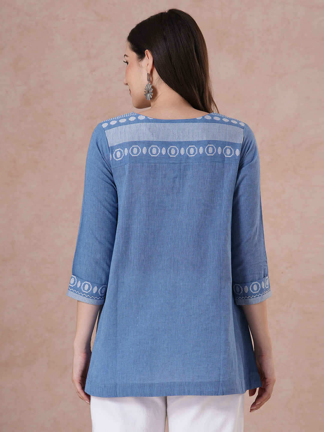 Woven cotton dobby tunic in light pink shade with hand embroidery.