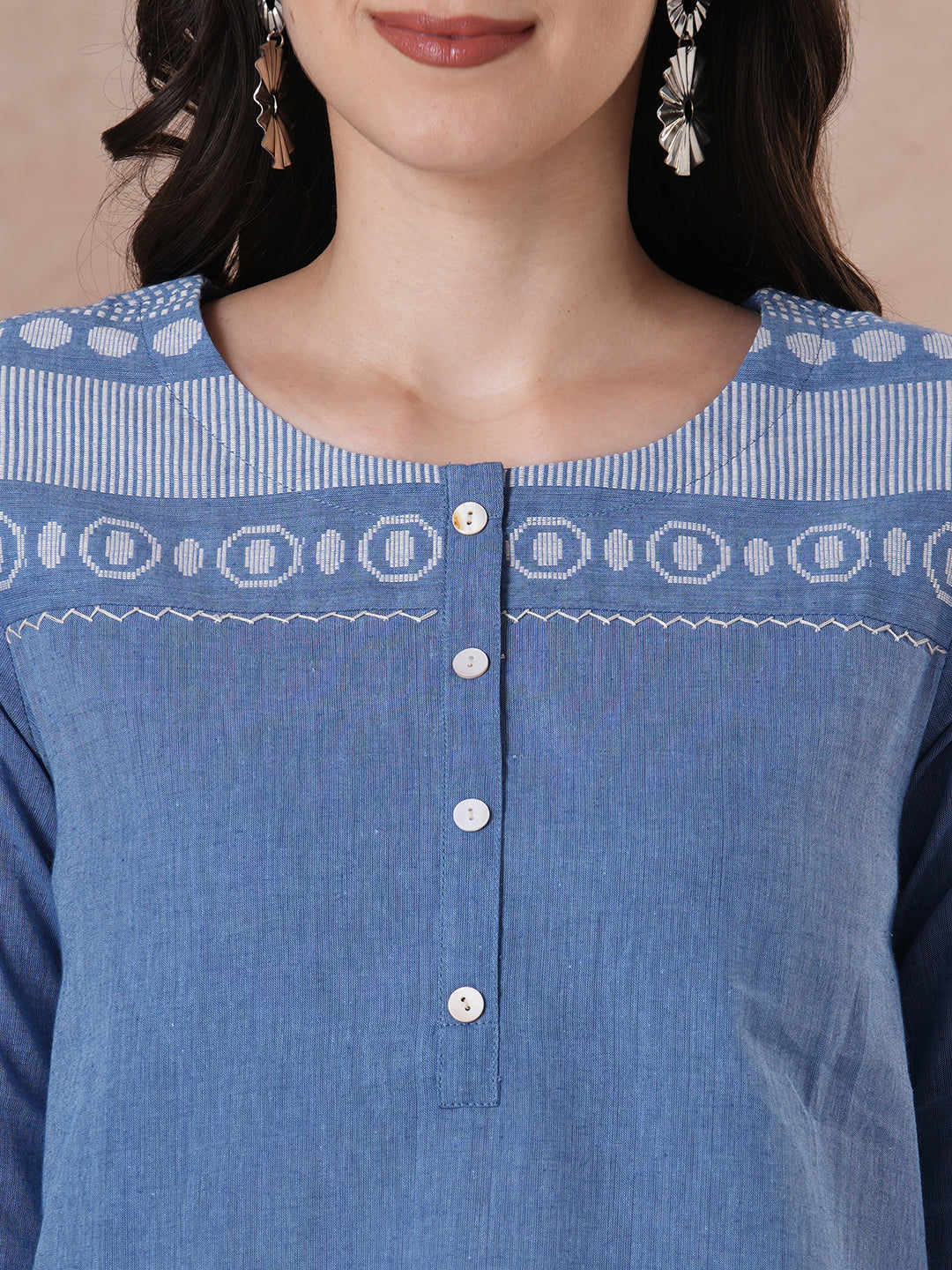 Woven cotton dobby tunic in light pink shade with hand embroidery.