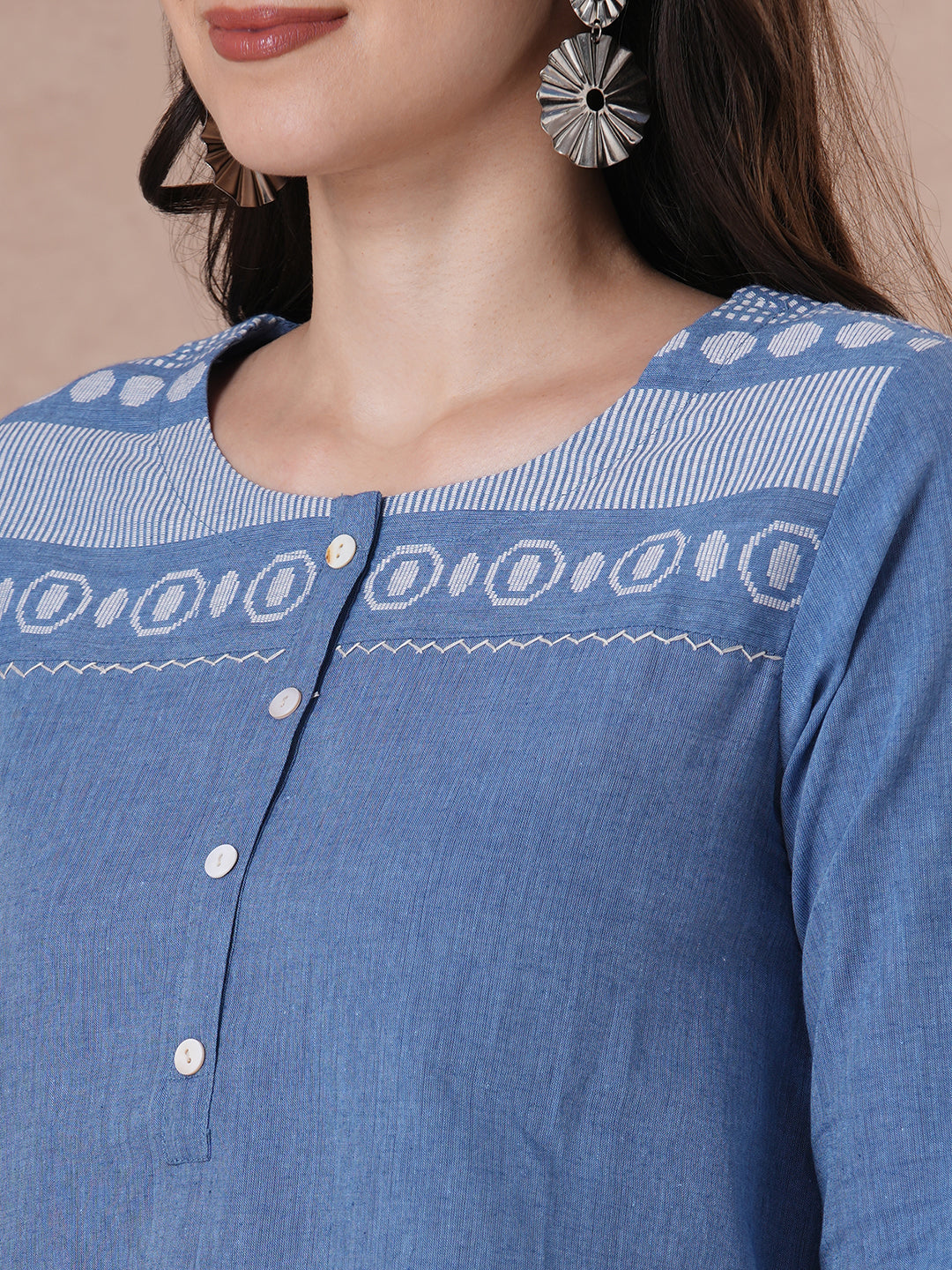 Woven cotton dobby tunic in light pink shade with hand embroidery.